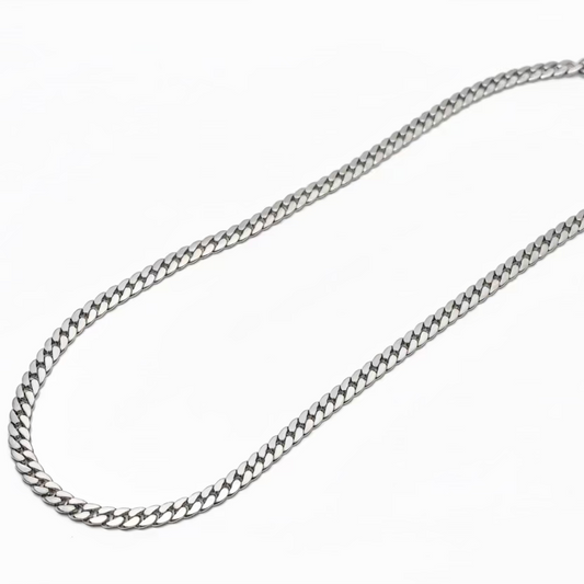 Silver curb chain necklace on white background, anti-tarnish jewelry for men and women